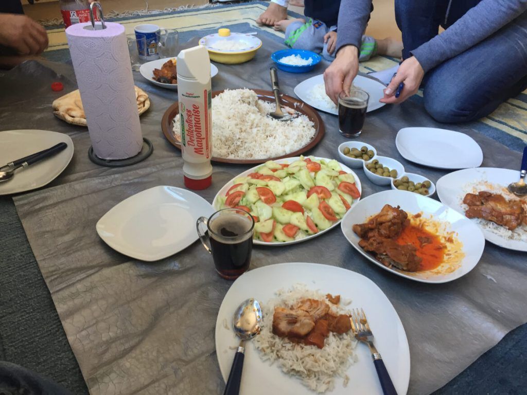 Breaking bread with a refugee family